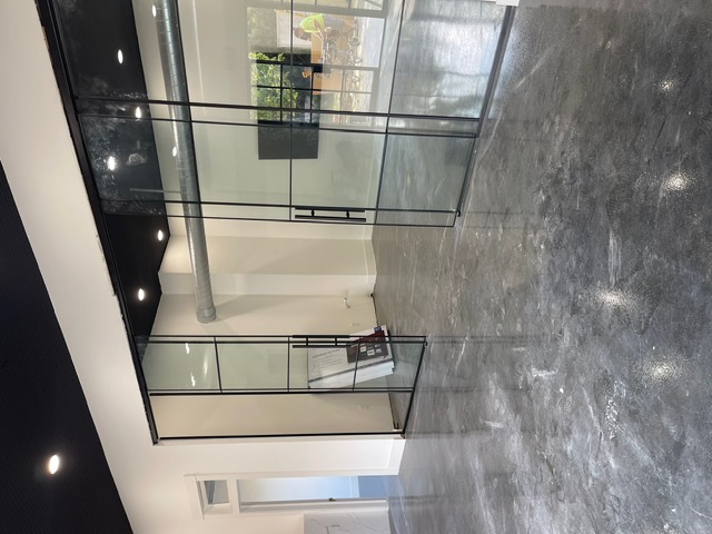 Modern office space with glass partition wall painting Houston TX
