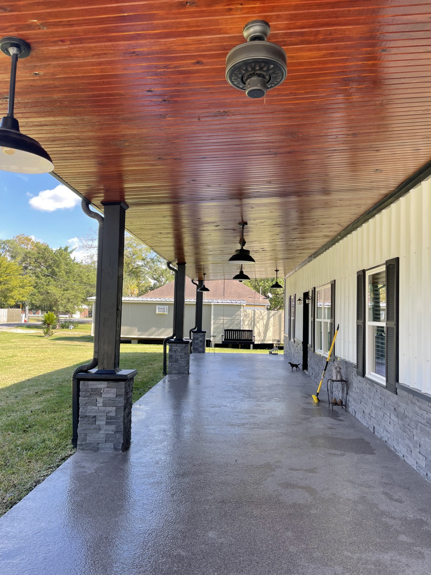 Long view of finished stained porch and patio